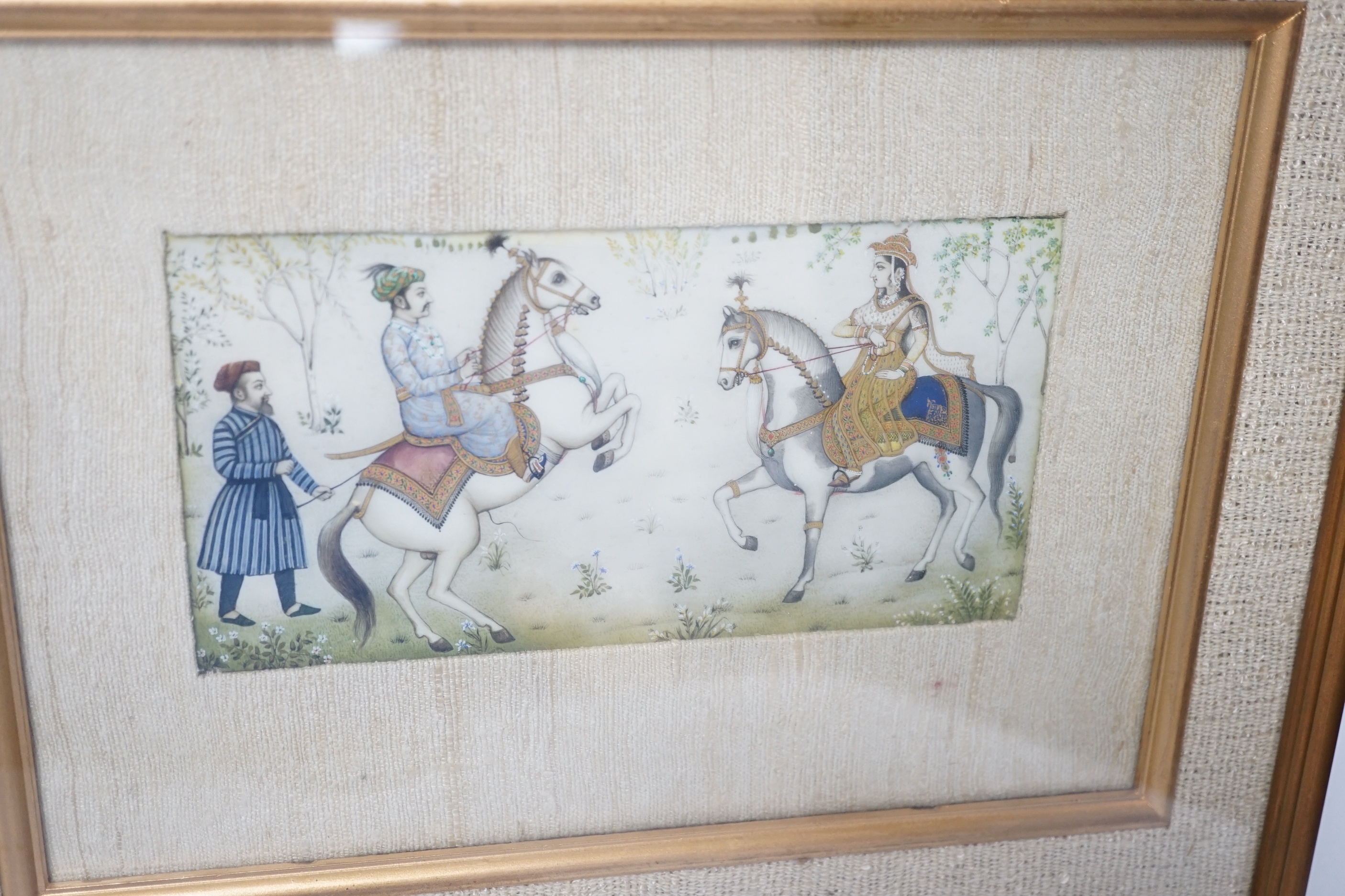 Indian Mughal style miniature on ivorine, 20th century depicting Shah Jehan - Mumtaz Ali on horseback, glazed frame, 20cm wide x 10cm high